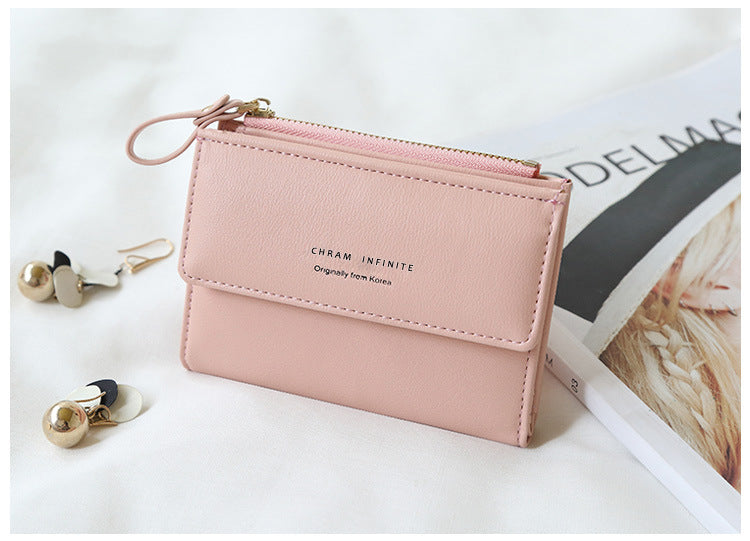 Compact women's wallet in trendy black