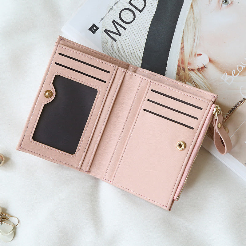 Compact women's wallet in trendy black