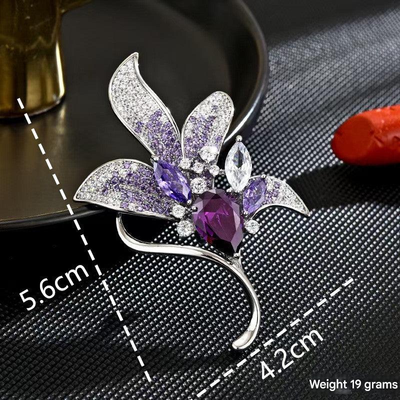 Chic brooch with purple lily design on a jacket