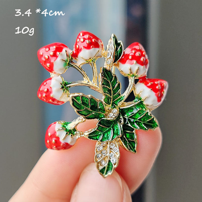 Unique strawberry design brooch on fabric