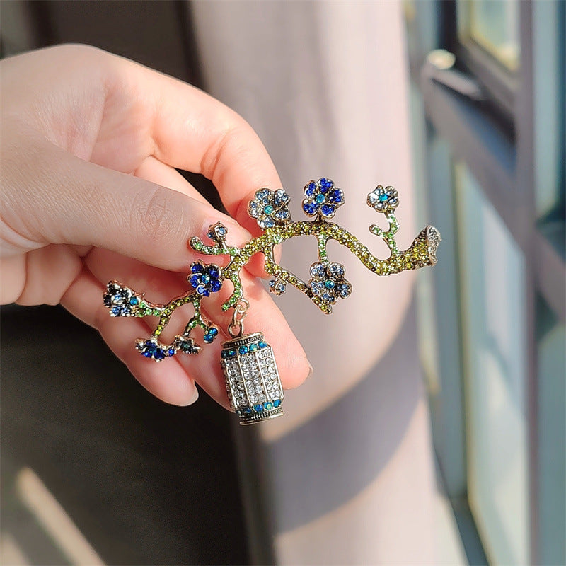 Floral brooch with rhinestones on display