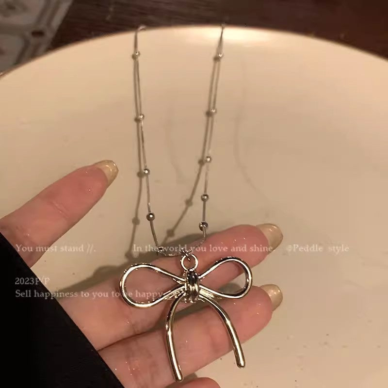 Chic Bowknot Sweater Necklace image 1