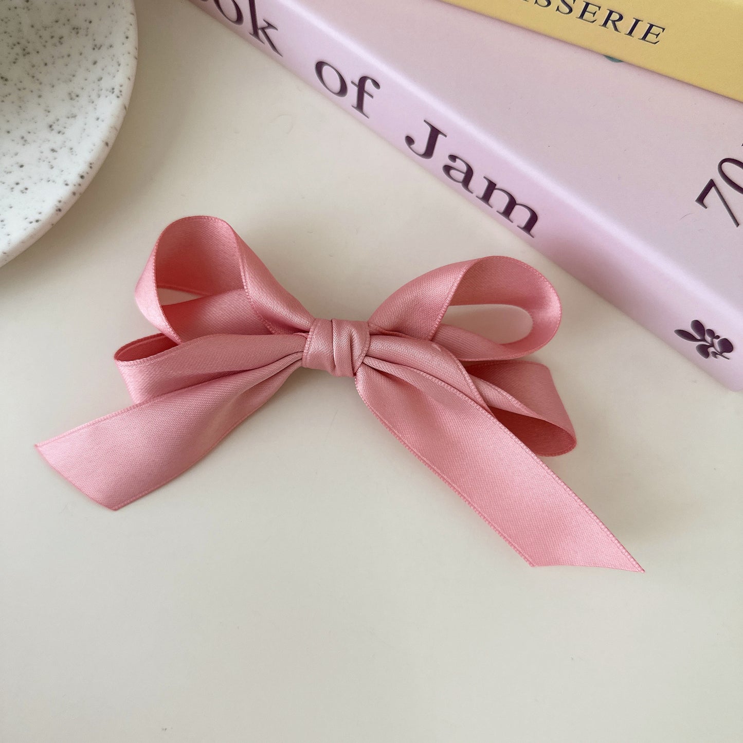 Blue bow hair clip styled on child's hair