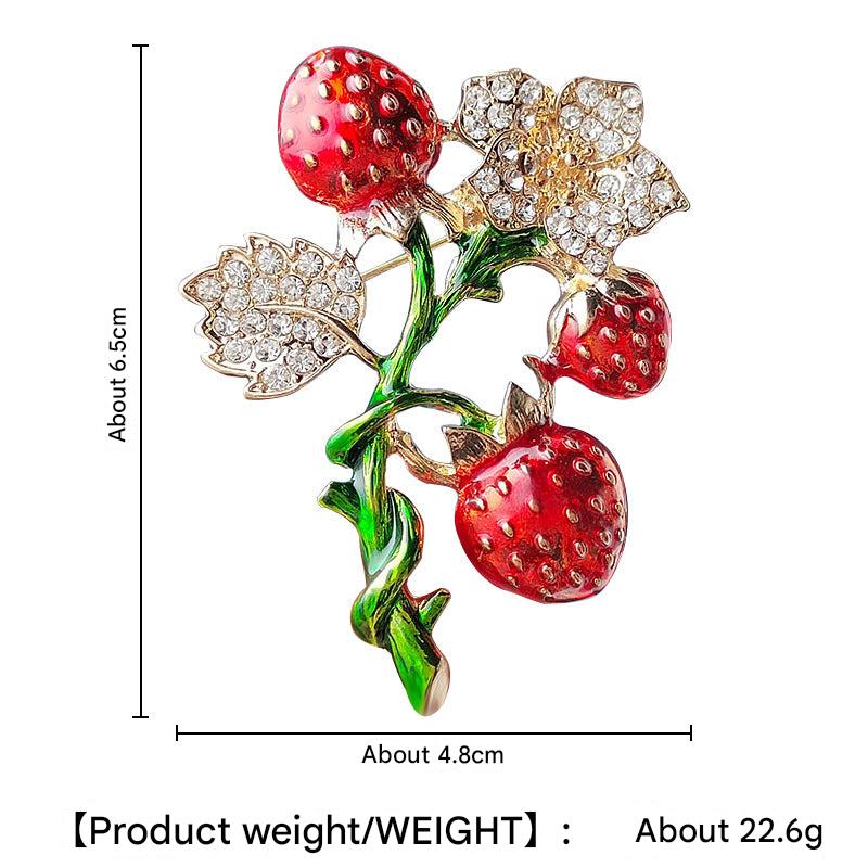 Unique strawberry design brooch on fabric