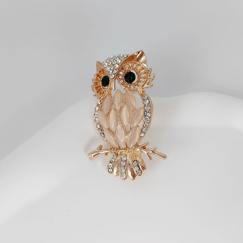 Owl brooch in gold and silver