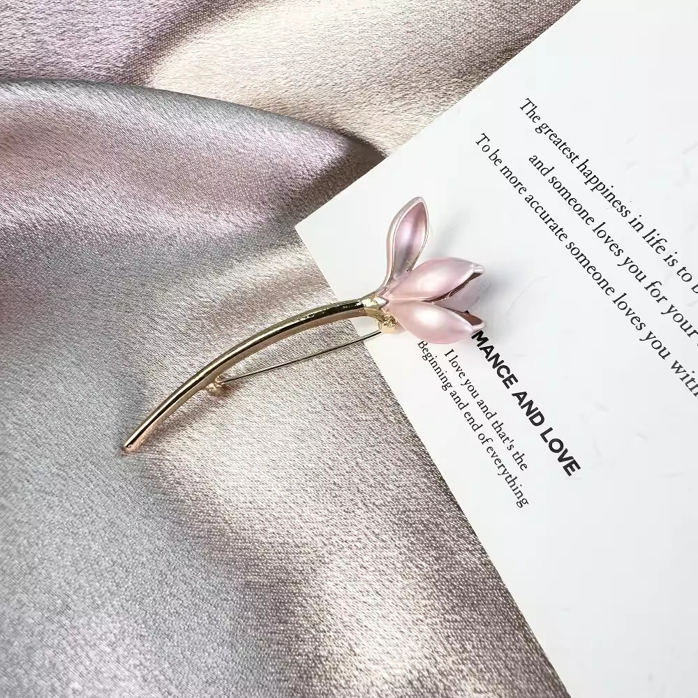 Pink Lotus Flower Brooch on black fabric background