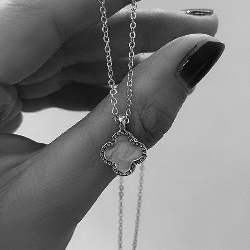Image of a four-leaf clover necklace in gold