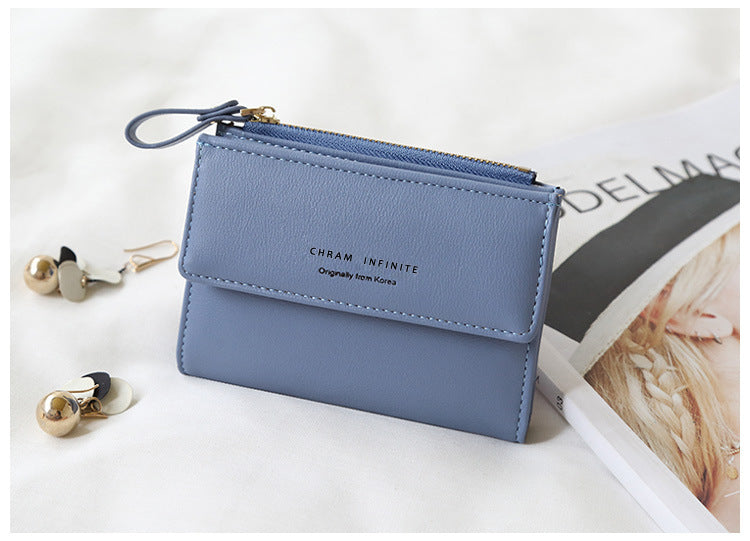 Compact women's wallet in trendy black