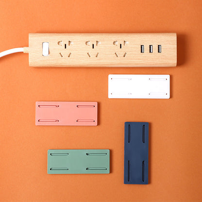 dual power strip holders mounted on white wall