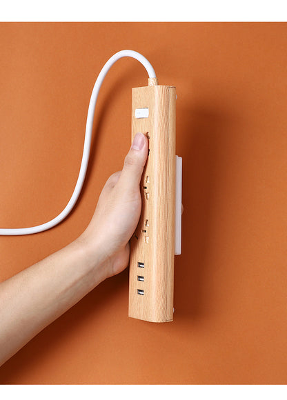 close-up of wall-mounted power strip holder