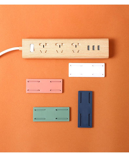 green and blue power strip holder with router