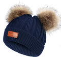 Navy blue hat with double pom-poms