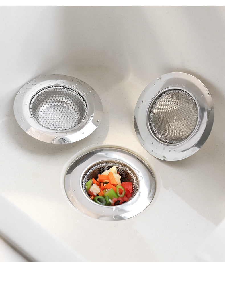 Kitchen sink with installed strainer preventing clogs