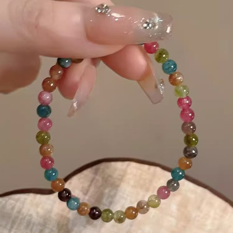 Model wearing the beaded bracelet with a stylish outfit
