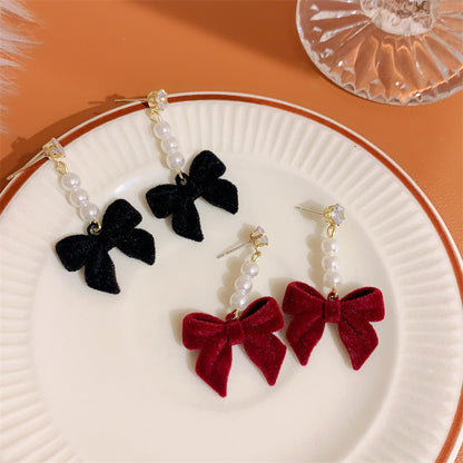 Elegant pearl stud earrings in red