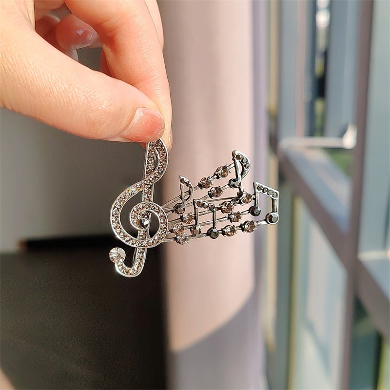 musical note brooch gray color rhinestones
