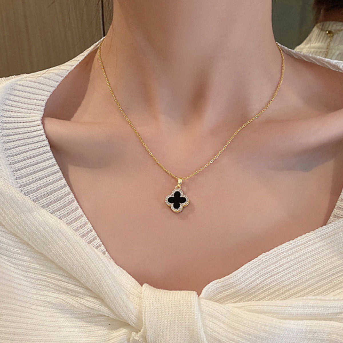 Artistic view of the necklace with a casual outfit