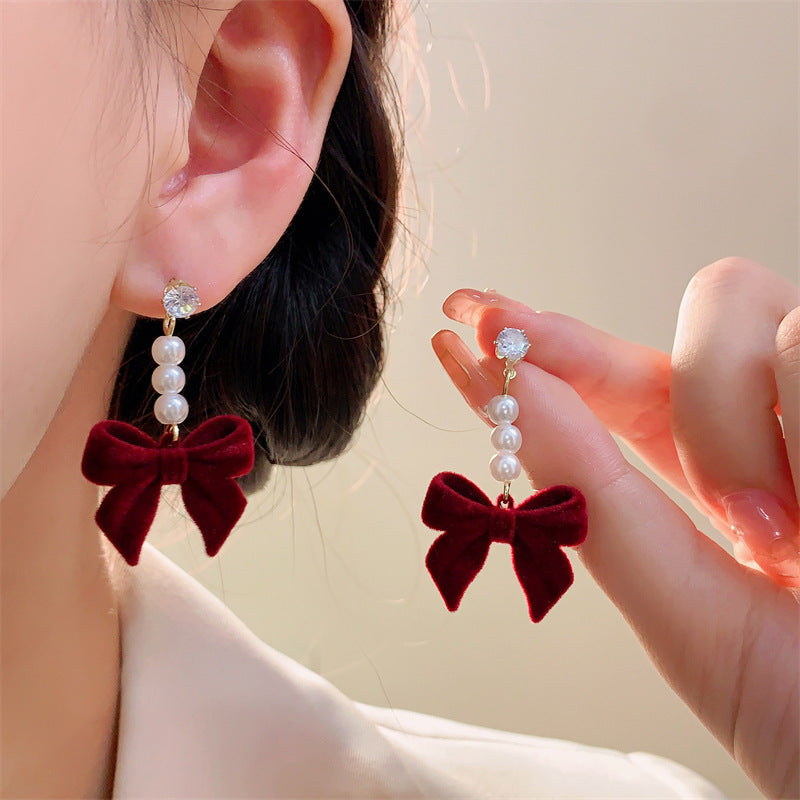 Elegant pearl stud earrings in red