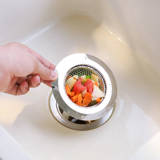 Kitchen sink with installed strainer preventing clogs
