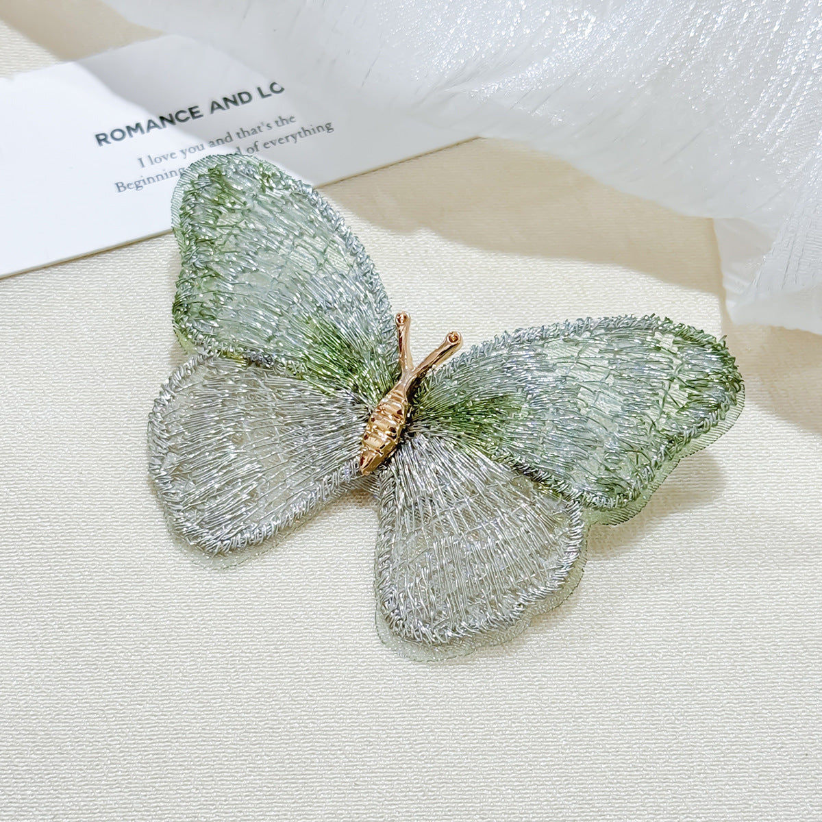 Embroidered butterfly brooch in purple