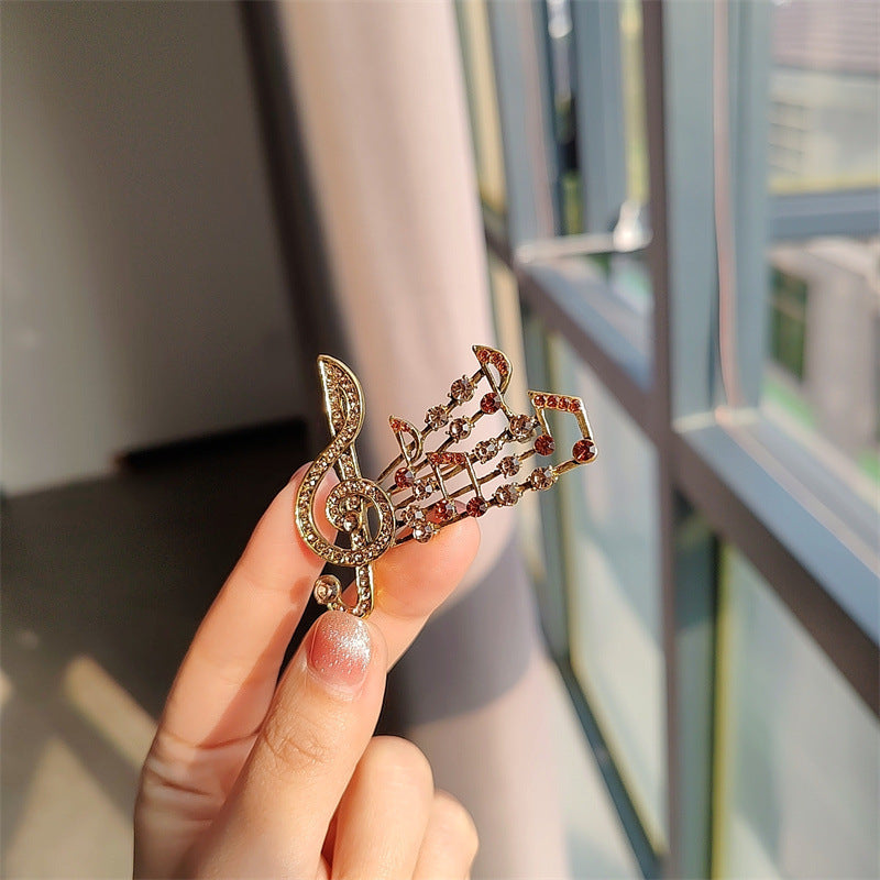 musical note brooch brown color rhinestones