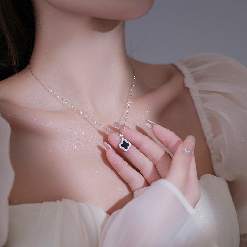 Elegant floral necklace hanging on display