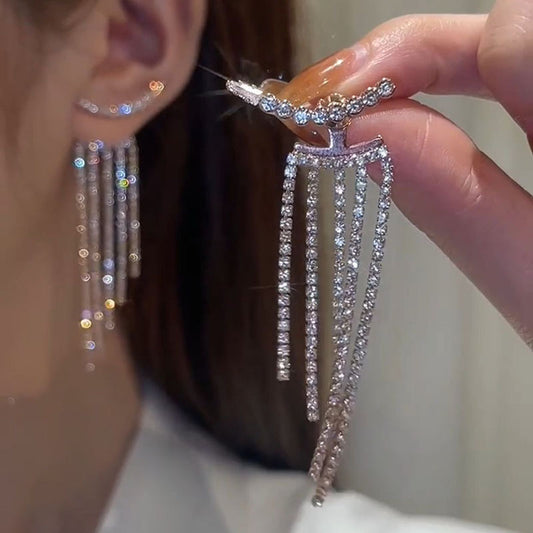 Flat lay of tassel earrings - image 5