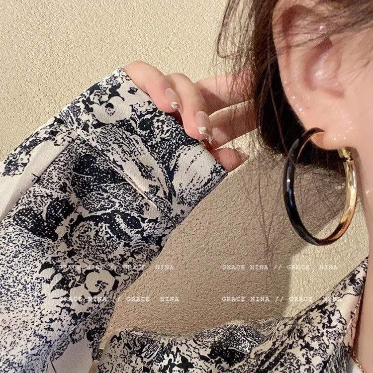 Fashionable oversized white circle earrings