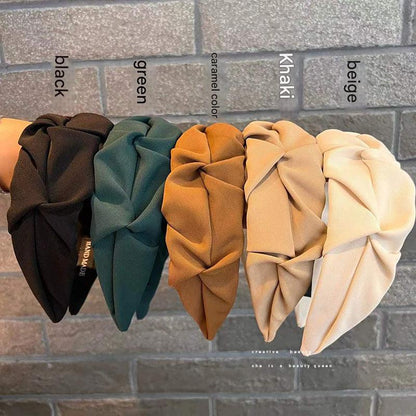 Stylish wrinkled wide hairband fabric close-up