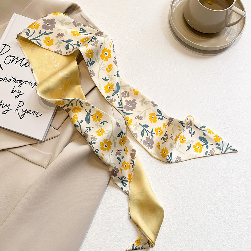 Yellow scarf displaying floral designs