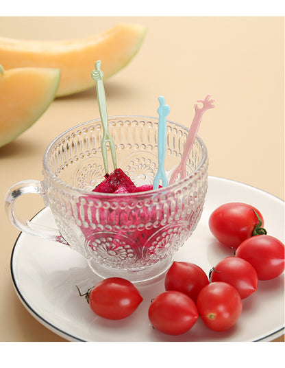 close up image of colorful disposable forks