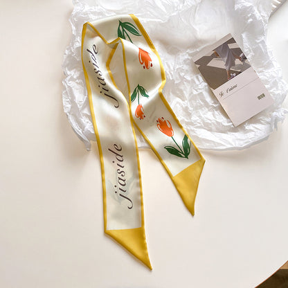 Yellow floral scarf tied to bag