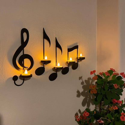 Iron candle holder on wall