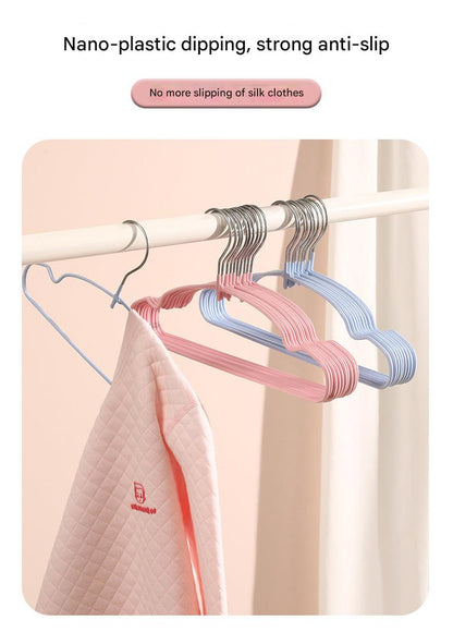 Colorful children's hangers displayed in a closet