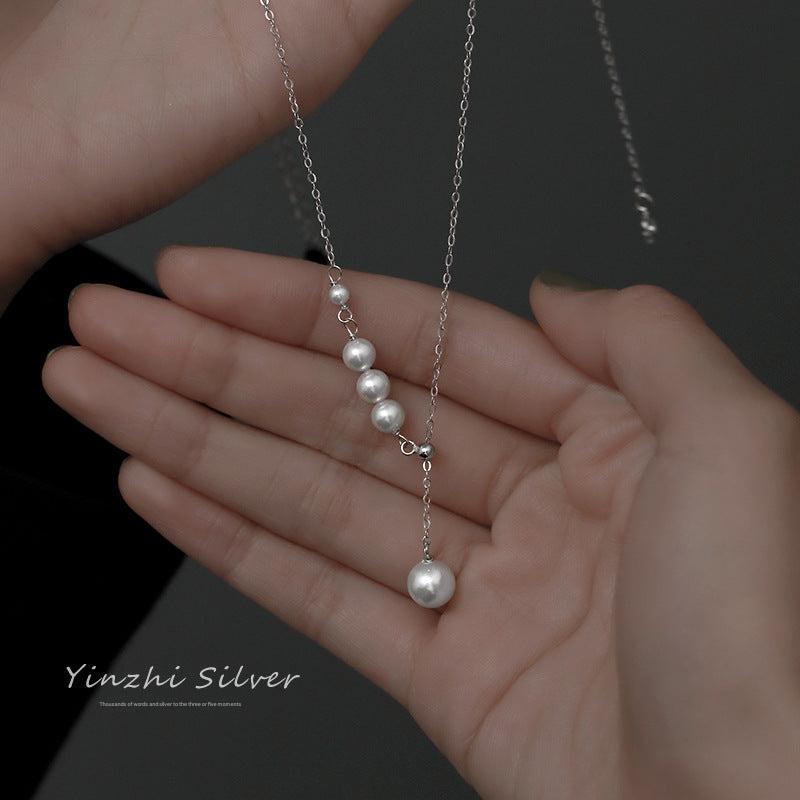 Elegant S925 silver tassel necklace on display
