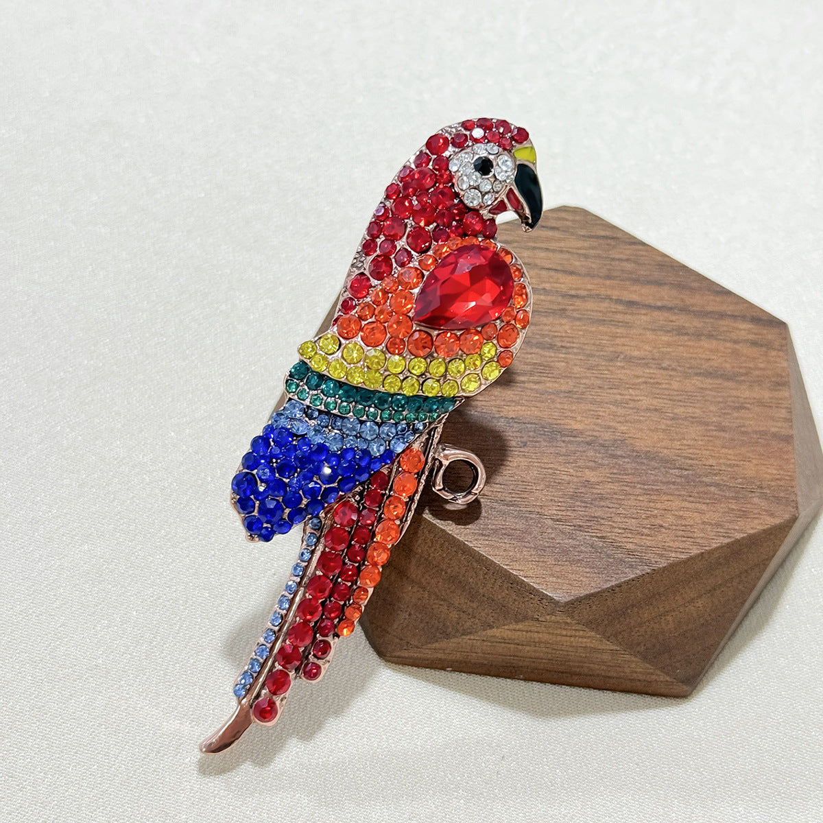 Elegant parrot pin brooch on a scarf