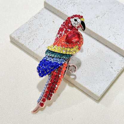 Elegant parrot pin brooch on a scarf