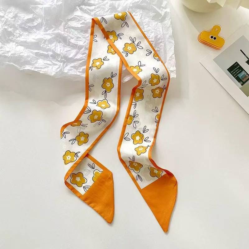 Yellow scarf displaying floral designs