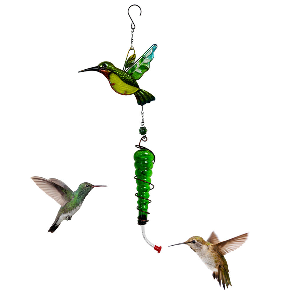 Hummingbird-themed garden accessory in metal and glass
