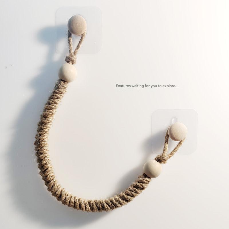 Handwoven rope toilet paper holder front view