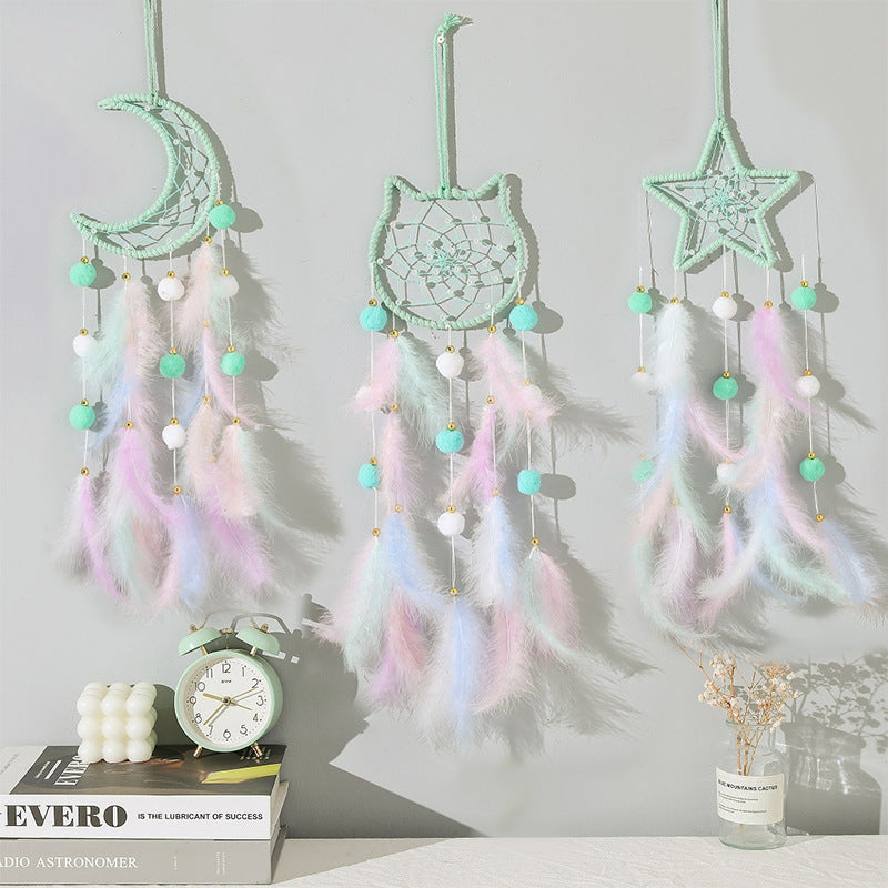Completed feather wind chime hung in a child's room