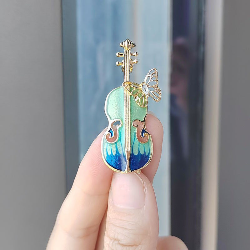 Close-up of Violin Brooch Detailing
