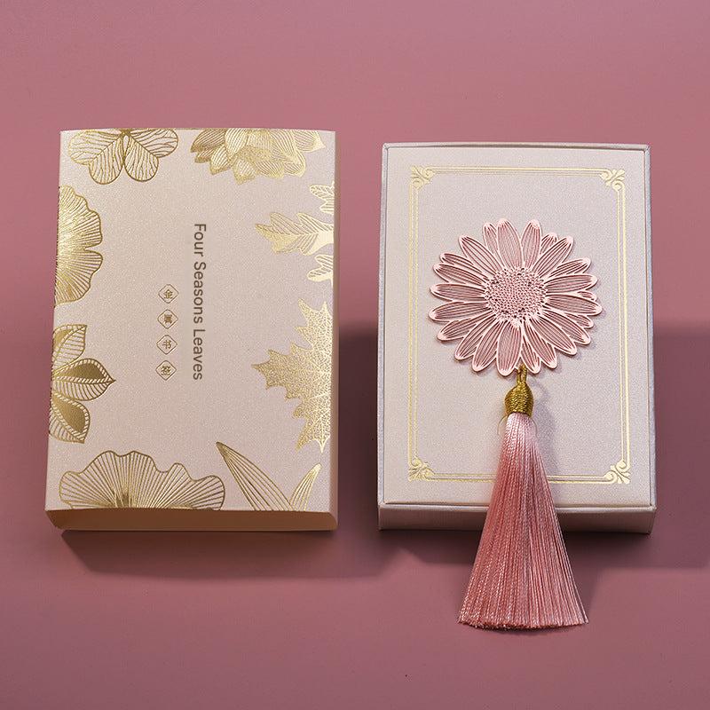 Elegant metal bookmark displayed on an open book