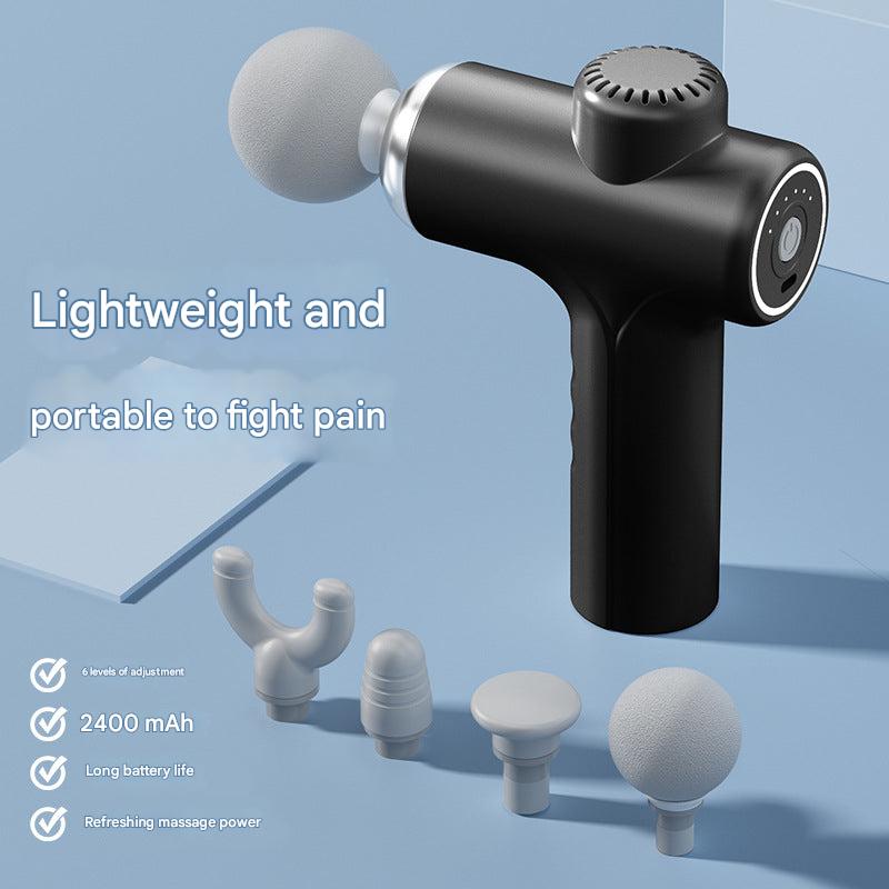 User holding portable massage gun