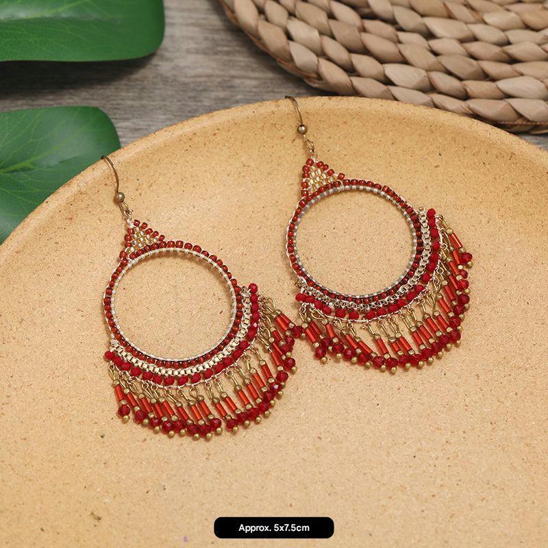 Artistic handmade earrings on display image 10